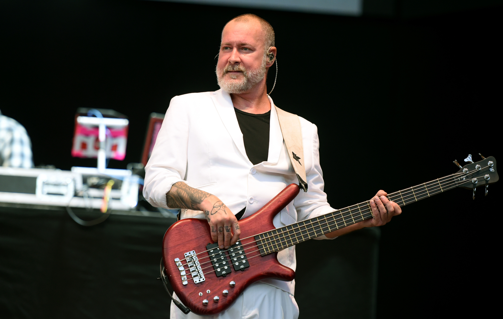 Sam Rivers performing live on stage with Limp Bizkit, photo by Matthew Baker/Getty
