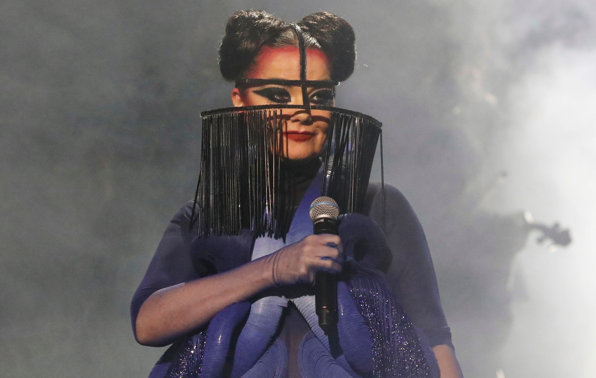 Björk performs on stage