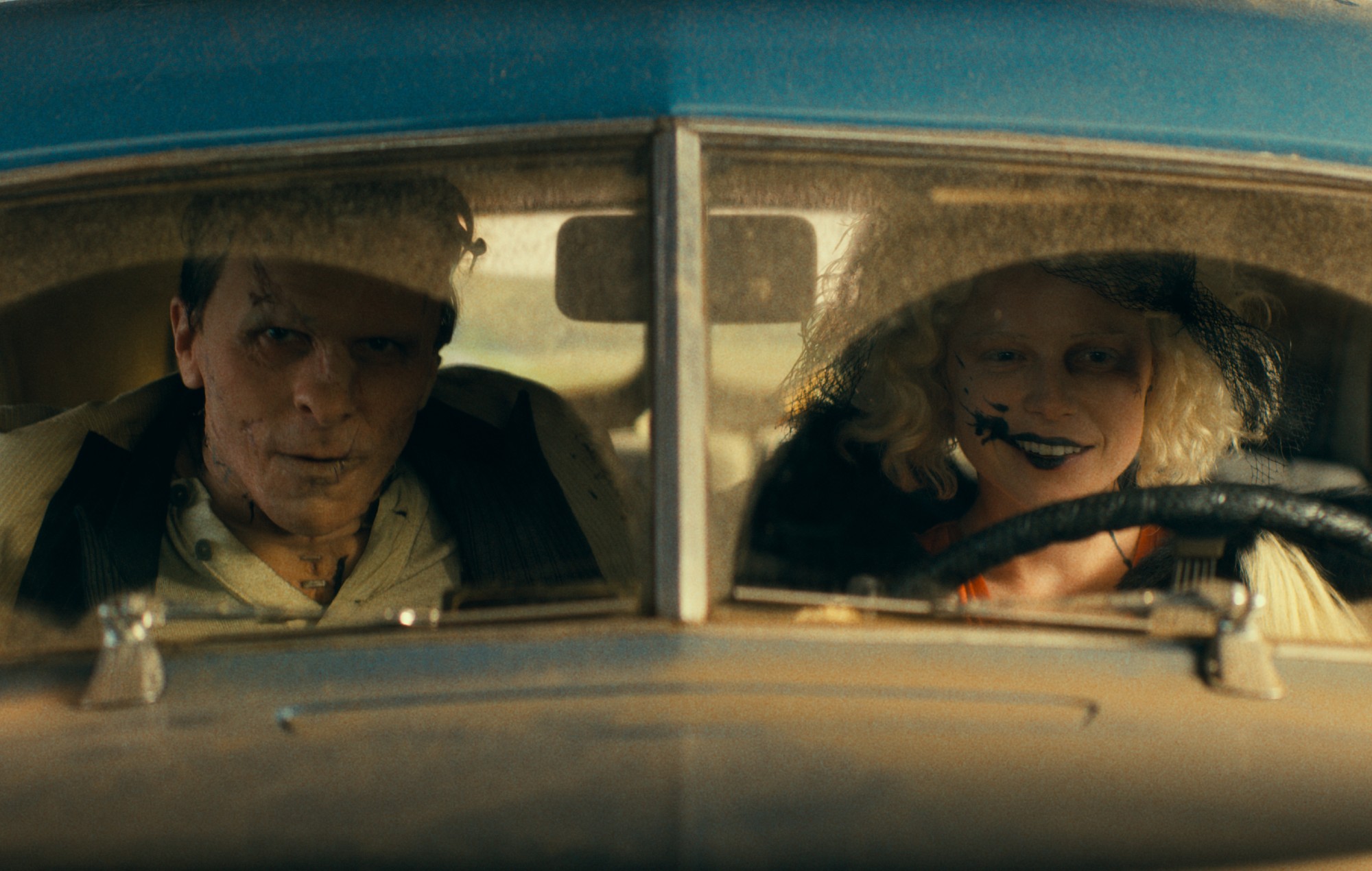 Christian Bale as Frank and Jessie Buckley as The Bride in 'THE BRIDE!'.