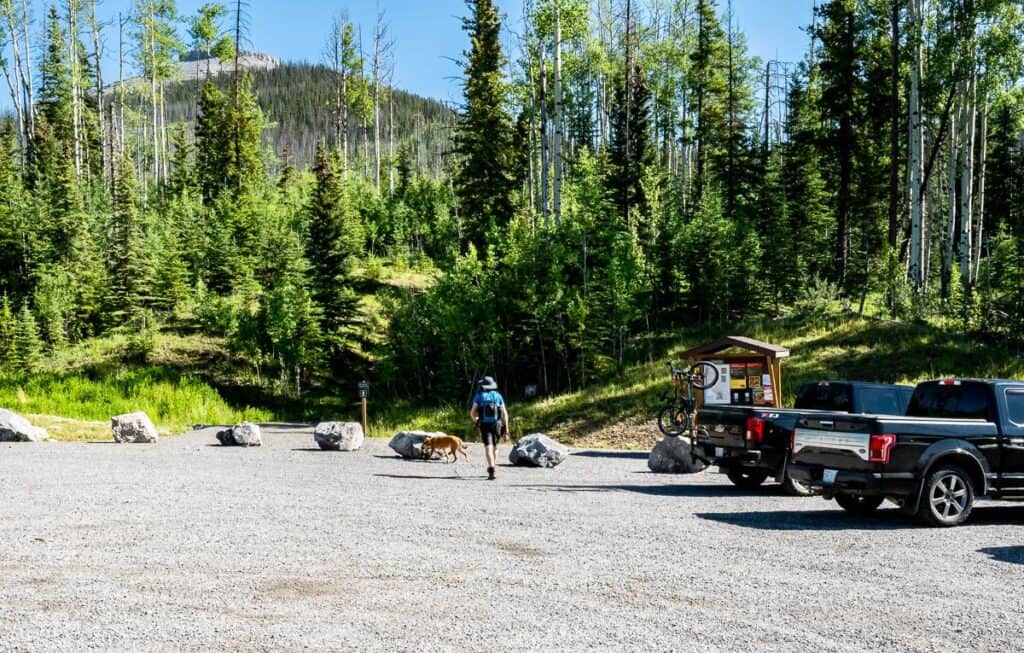 The trailhead for Coliseum Mountain is to the right of the trucks
