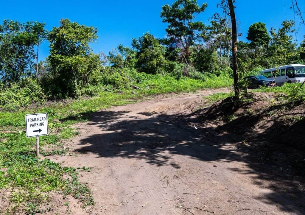 Trailhead parking signage for the Mount Liamuiga volcano hike at the end of the access road