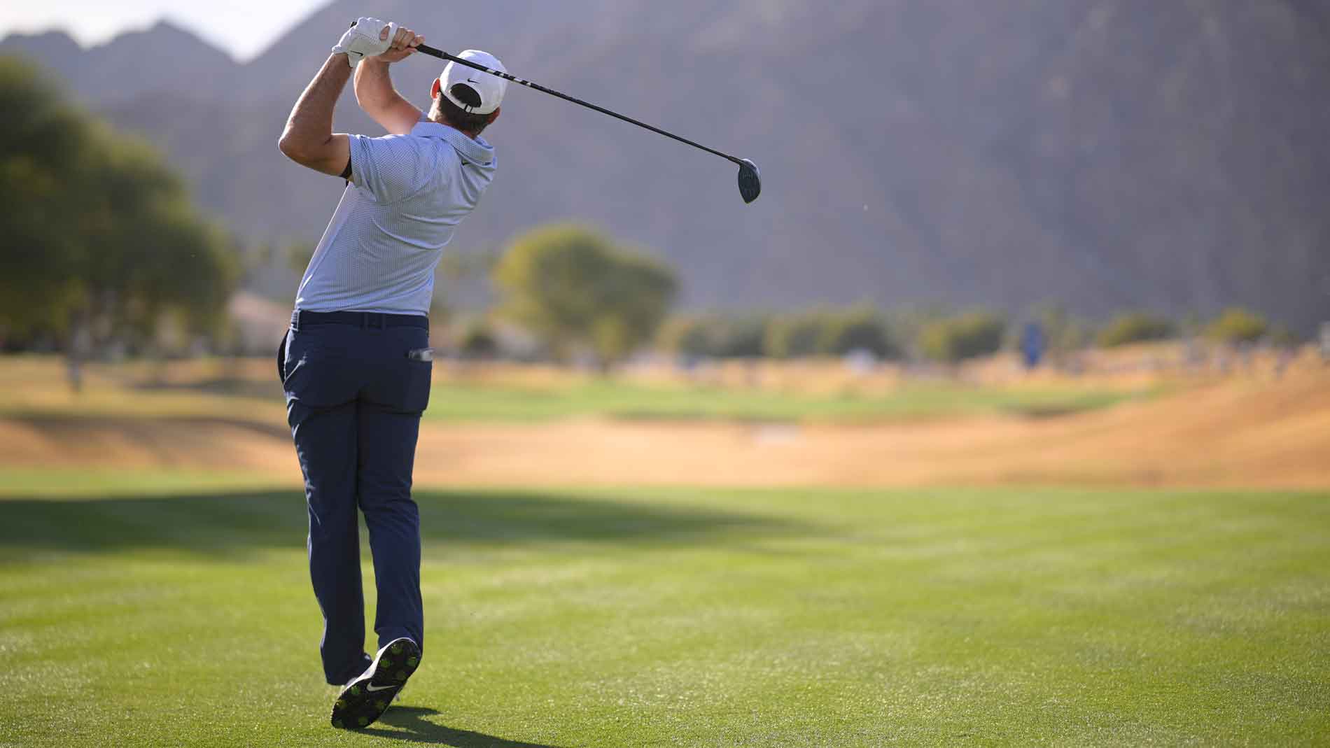 Scottie Scheffler of the United States plays his shot from the 15th tee during the final round of The American Express 2026 at Pete Dye Stadium Course