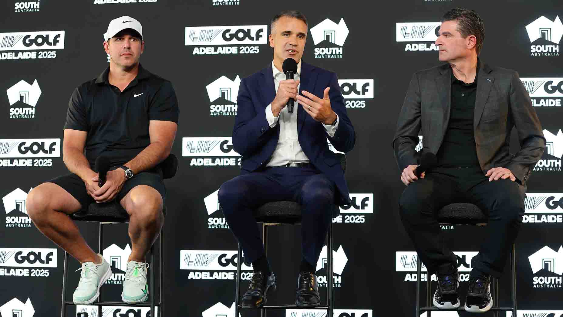 Brooks Koepka, LIV Golf CEO Scott O'Neil and Peter Malinauskas talk at a press conference at LIV Adelaide