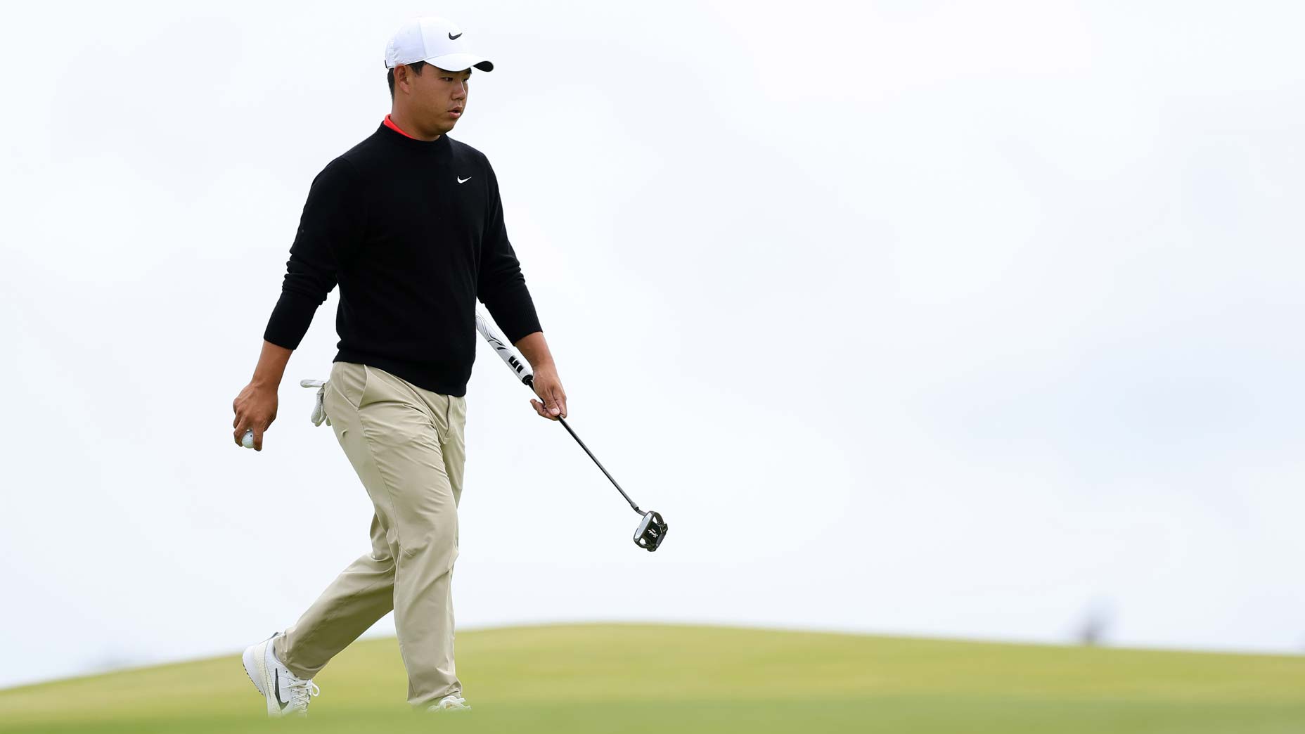 Tom Kim of South Korea walks on the first green during a practice round prior to The 153rd Open Championship at Royal Portrush Golf Club on July 15, 2025 in Portrush, Northern Ireland.