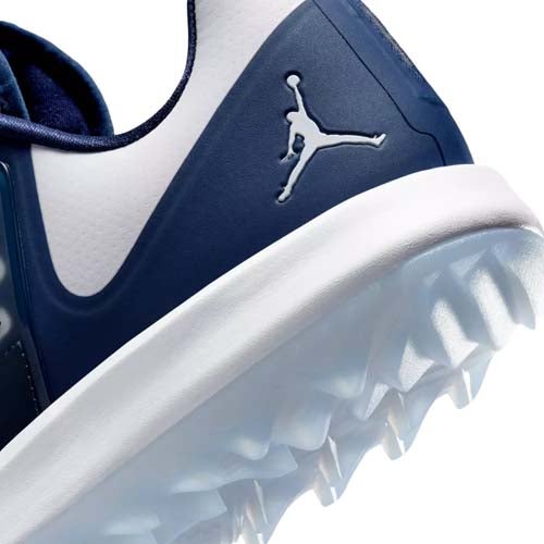 Close-up of the heel of a blue and white athletic shoe with a visible Jumpman logo. The textured, translucent sole is designed for traction, making it one of the best Jordan golf shoes for both style and performance on the course.
