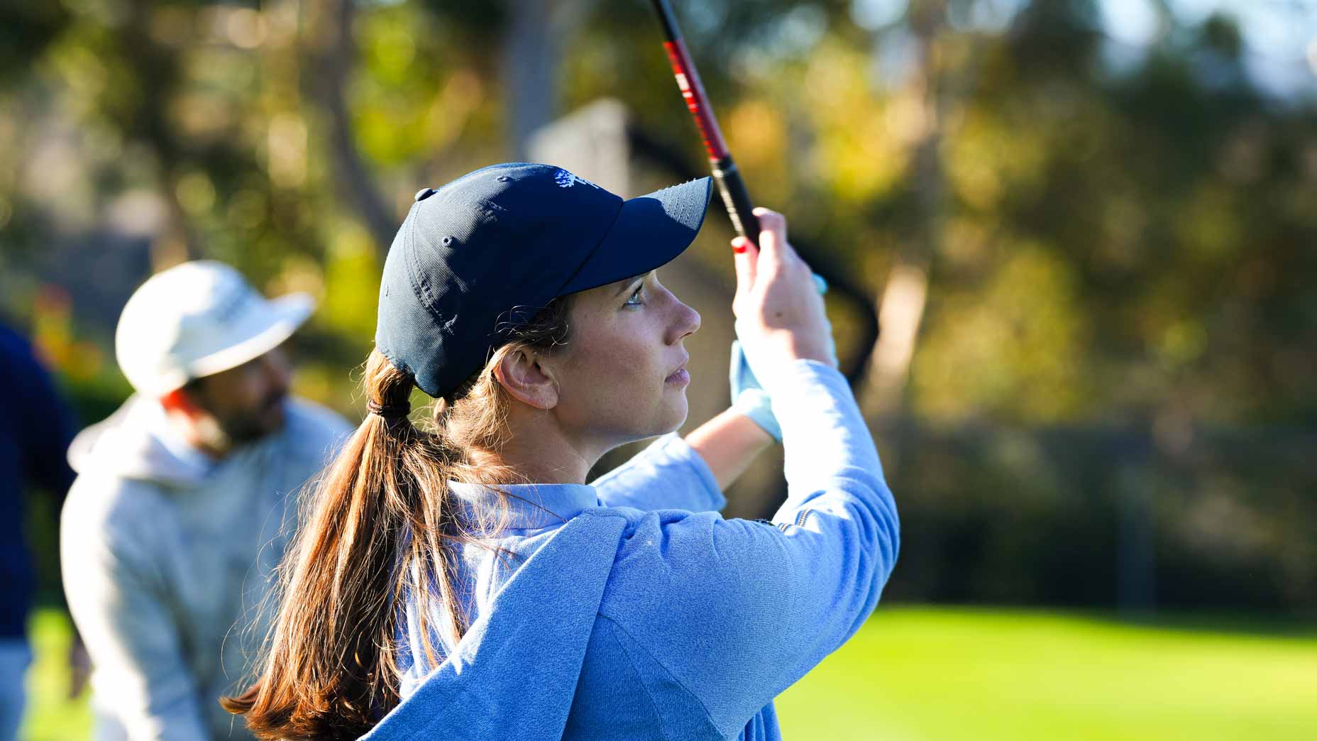 Maddi MacClurg testing clubs