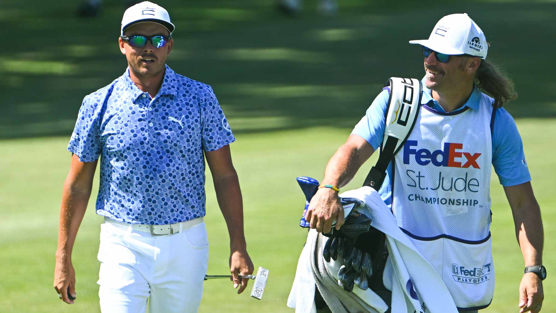 Rickie Fowler with his caddie Ben Schomin at the ninth hole during the third round of the FedEx St. Jude Championship at TPC Southwind on August 13, 2022 in Memphis, Tennessee. (Photo by Tracy Wilcox/PGA TOUR via Getty Images)