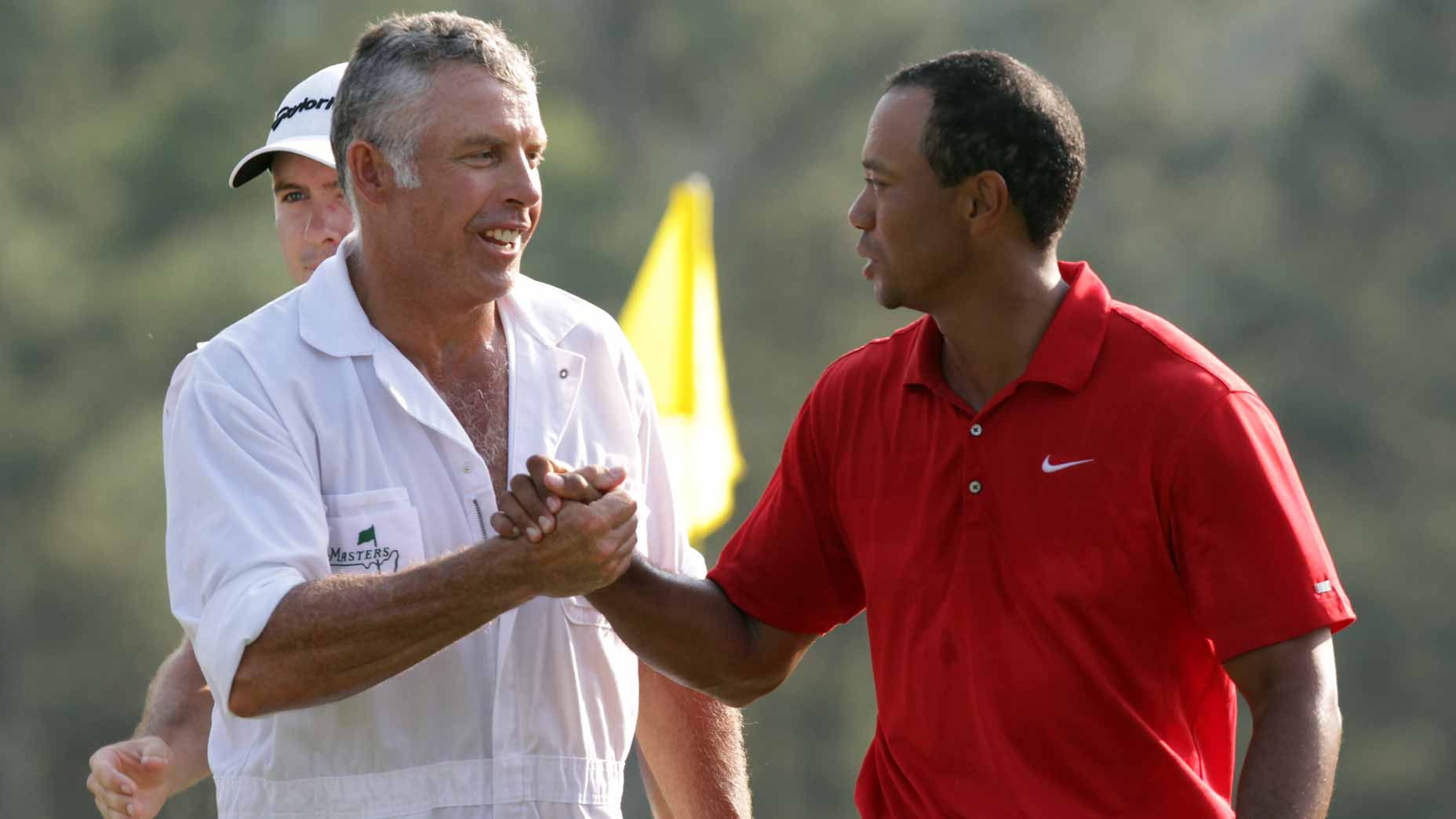 Tiger Woods and caddie Steve Williams embrace after the final round of the 2011 Masters.