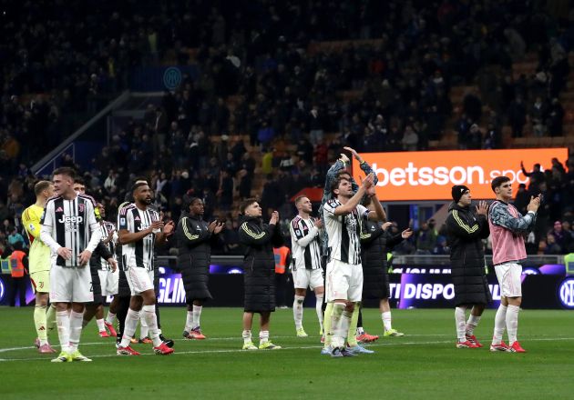 Juventus player applauding the supporters at San Siro