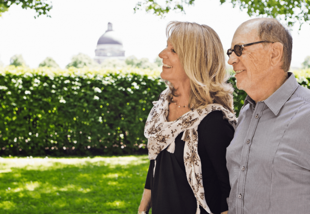 Older couple walking hand-in-hand
