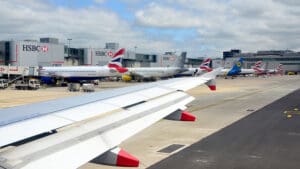 The owner of British Airways has launched a fresh €1.5 billion share buyback after reporting record annual profits, underlining the scale of the post-pandemic turnaround in the airline industry. International Airlines Group (IAG), which also owns British Airways, Iberia, Aer Lingus and Vueling, reported a 22 per cent rise in profit after tax to €3.34 billion for 2025. Group revenues climbed 3.5 per cent to €33.2 billion, despite passenger numbers edging down slightly to 121.5 million compared with the previous year. The improvement was driven by stronger pricing and higher revenue per passenger rather than volume growth. In response, the FTSE 100-listed airline group announced an 8.9 per cent increase in its dividend and unveiled a €1.5 billion share buyback programme. It follows a €1 billion buyback completed last year and adds to a growing trend of large UK corporates returning surplus cash to investors. IAG said market conditions remained supportive, citing long-term demand growth across its core transatlantic and European markets, combined with constrained aircraft supply as manufacturers struggle with delivery delays. “Market dynamics are compelling – long-term demand growth in our core markets and constrained supply in a consolidating industry,” the company said. Share buybacks reduce the number of shares in circulation, increasing earnings per share and often supporting share price performance. IAG’s shares, which were trading below £1 during the depths of the pandemic, are now approaching historic highs, having previously peaked at around 470p in 2018. The group has moved decisively from a crisis-era balance sheet to financial strength. Just over three years ago, IAG was carrying close to €20 billion of debt as international travel collapsed under Covid restrictions. Since then, it has restored profitability and significantly reduced leverage. Luis Gallego, IAG’s chief executive, said the group’s improved profitability was underpinned by higher margins across its airline brands. Iberia delivered an operating margin of 16.2 per cent, while British Airways achieved 15.1 per cent — both historically strong levels for the group. “Our margins are significantly better than those of many global competitors,” Gallego said. Looking ahead, IAG expects to grow capacity by between 2 and 4 per cent annually over the next few years. However, it anticipates that supply constraints — driven by delays from aircraft manufacturers — will limit industry-wide expansion, supporting pricing power. The North Atlantic remains IAG’s most important market, although growth has moderated. The group described the route network as increasingly mature, with future expansion likely to be in the low single digits. Demand from US travellers softened slightly during the summer peak season last year. By contrast, IAG expects mid-single-digit growth in the South Atlantic, where it holds a strong competitive position. Short-haul European operations, which account for more than a third of group capacity, have faced pressure from rising operating costs and weaker demand in parts of northern Europe. Despite those headwinds, the airline group’s record profitability and enhanced shareholder returns mark a striking contrast to its precarious position during the pandemic — and reinforce investor confidence in the durability of premium transatlantic and leisure travel demand.