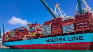 Global shipping giant Maersk has suspended operations at the Port of Salalah in Oman after a drone attack struck oil storage facilities at the strategic logistics hub, intensifying concerns about global trade disruption as the conflict involving Iran spreads across the Gulf.