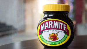 Marmite and other iconic brands will join US group McCormick in a £50bn deal, creating a global flavour powerhouse and raising concerns over UK jobs.
